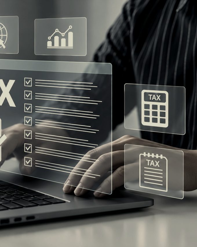 Working through a tax return at a laptop
